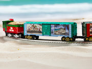 Lionel 2528430 Thomas Kinkade Studios Disney Mickey and Minnie in Florida boxcar, boxcar displayed on a layout; other rolling stock and scenery not included