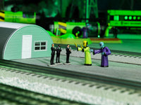 Lionel 2530010 Area 51 figures, figures displayed on a model railroad layout; scenery and track not included
