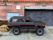 Loose Hot Wheels - 1988 Jeep Wagoneer - Satin Black and Red