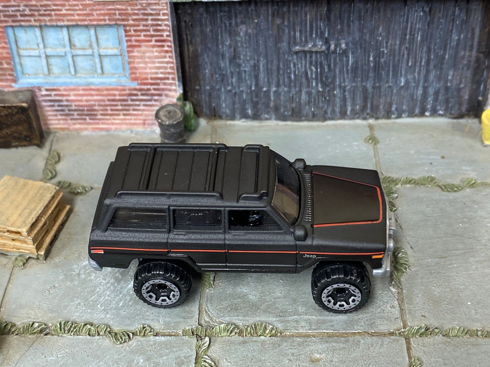 Loose Hot Wheels - 1988 Jeep Wagoneer - Satin Black and Red