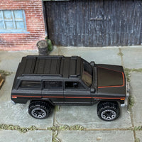 Loose Hot Wheels - 1988 Jeep Wagoneer - Satin Black and Red
