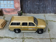 Matchbox 2000 Chevy Suburban Gold Boone County Sheriff loose diecast - side profile detail shot