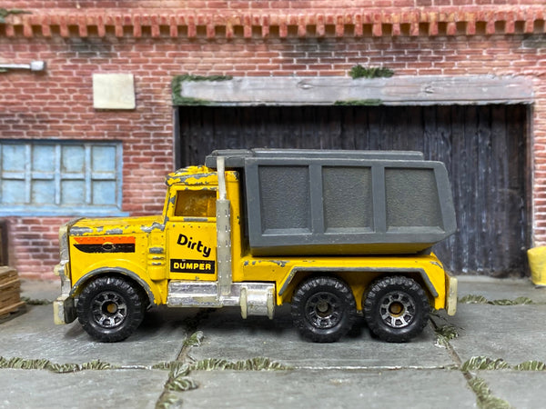 Matchbox Dirty Dumper Dump Truck in Yellow and Gray, loose diecast car