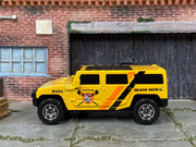 Matchbox Hummer H2 SUV Concept Yellow beach Patrol - rear angle view showing tampo details