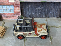 Matchbox Jeep Wrangler Jurassic Park Tour Jeep Gold and Red Muddy loose diecast - side profile detail shot