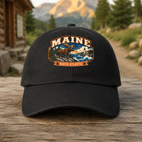 Maine heritage badge on a black embroidered dad hat outdoors