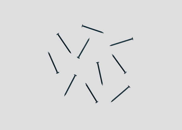 Märklin 8999 Z scale track nails, representative sample from the 100-piece pack