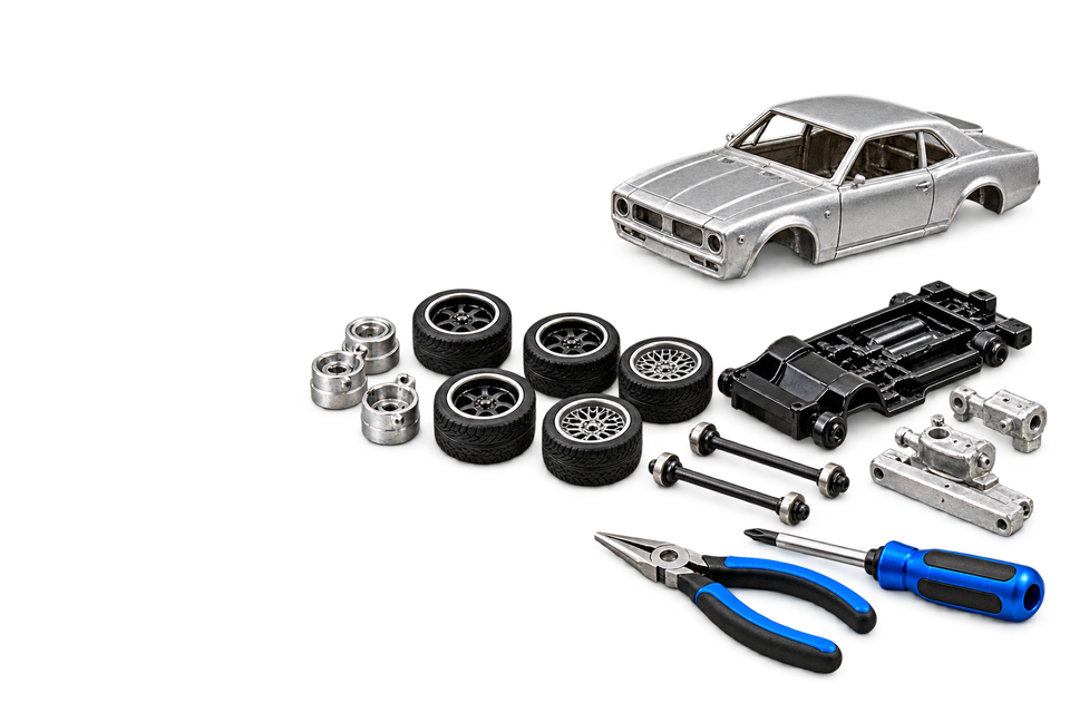 Unpainted donor casting, chassis, wheels, tires, axles and blue hand tools