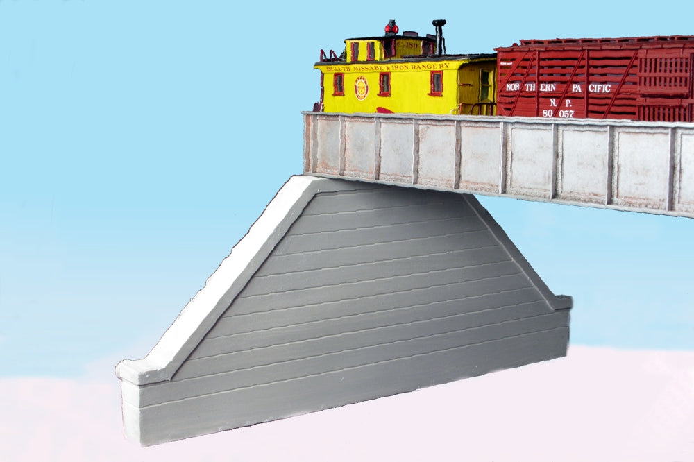 Monroe Models 118 HO scale groove-face concrete bridge abutment, painted example of one abutment from the two-pack. Supplied unpainted; bridge and rolling stock shown for context.