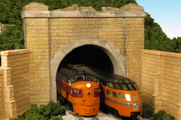 Monroe Models 132 HO scale granite-face Hoosac double-track tunnel portal, painted layout example. Portal supplied unpainted; locomotives, wing walls and scenery shown for context.