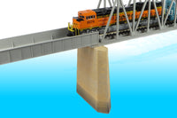 Monroe Models 257 N scale Single-Track Concrete Bridge Pier, manufacturer painted example supporting a bridge. Bridge, track and train not included.