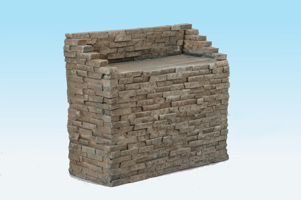Monroe Models AIM 718 HO scale split-stone bridge abutment, one painted demonstration casting shown from the front and side; product supplied as a two-pack of unpainted castings.