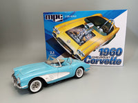MPC1002 1/25 1960 Chevrolet Corvette 7-in-1 model kit — assembled and painted example beside kit box