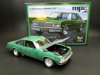 MPC1003 1/25 1979 Chevy Nova model kit — assembled and painted example beside kit box