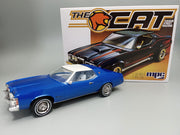 MPC1004M 1/25 1973 Mercury Cougar "The Cat" model kit — assembled and painted example beside kit box