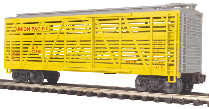 MTH 20-94730 O scale Union Pacific yellow steel-sided stock car with silver roof