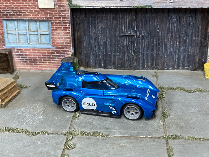 McMurtry Spéirling custom Hot Wheels in metallic blue number 55.9 with gray wheels and rubber tires