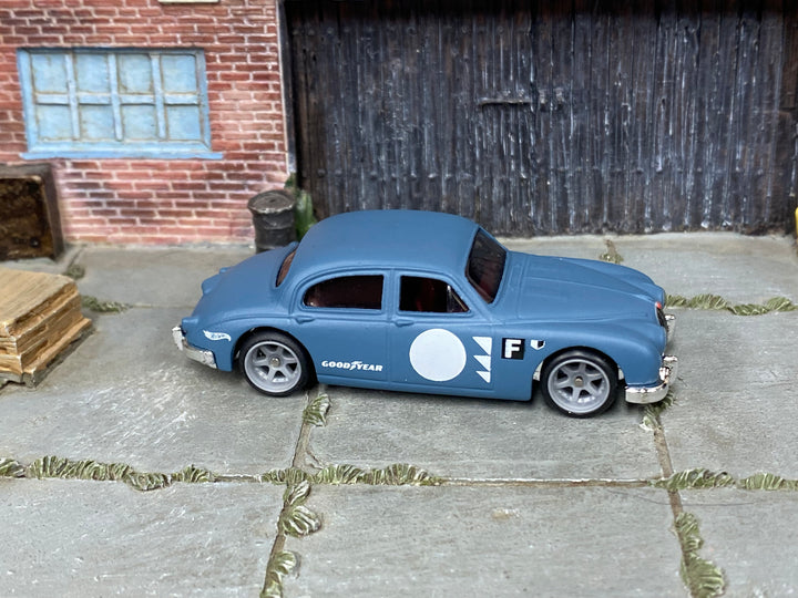 Jaguar Mk1 custom Hot Wheels in blue-gray race livery with gray wheels and rubber tires