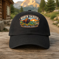 North Dakota heritage badge on a black embroidered dad hat outdoors