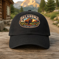 Oklahoma heritage badge on a black embroidered dad hat outdoors