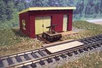 Assembled Osborn Model Kits RRA-1108 HO maintenance of way shed with handcar; scenery shown for illustration