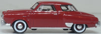 Oxford Diecast 87SC50003 1950 Studebaker Champion Starlight Coupe in Commanche Red, 1:87 scale model, left side view.