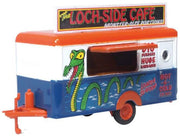 Oxford Diecast 87TR020 Loch-Side Cafe mobile food trailer in blue, white and orange with green monster graphics, 1:87 scale, front three-quarter view
