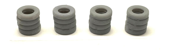Four unpainted Phoenix Precision Models 30540 N-scale tire stacks