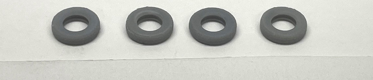 Four unpainted Phoenix Precision Models PPM-30541 N-scale individual tires