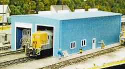 Pikestuff 541-0008 HO enginehouse kit shown assembled in a layout scene; trains and scenery sold separately