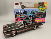 Assembled Polar Lights POL1007 Batmobile example beside the kit package; assembly required