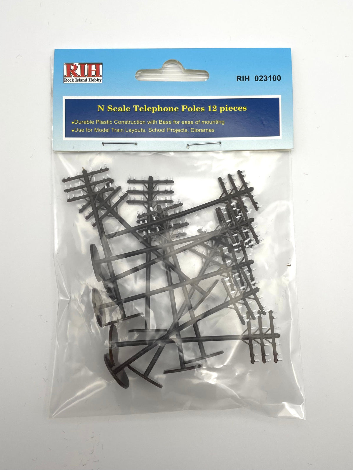 Rock Island Hobby 023100 N scale telephone poles, 12-piece pack, retail packaging.