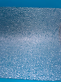 Rock Island Hobby 024441 clear Choppy Water plastic sheets, two-sheet pack, sheet texture shown over a blue background.