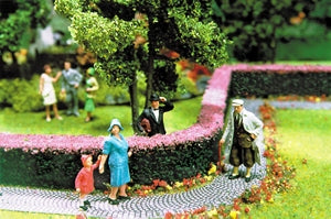 Scenic Express 0512 pink flowering hedges in a manufacturer scenery example; figures, trees and other scenic accessories not included.