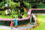 Scenic Express 0512 pink flowering hedges in a manufacturer scenery example; figures, trees and other scenic accessories not included.