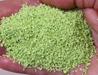 Scenic Express 6213 Pale Green SuperLeaf, 24 oz Eco Pak; manufacturer leaf-flake sample in hand, package not shown.