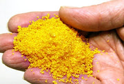 Scenic Express 6323 Aspen Yellow SuperLeaf, 24 oz Eco Pak; manufacturer leaf-flake sample in hand, package not shown.