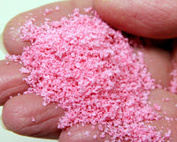 Scenic Express 6533 Pink Petunia Leaf Petals, 24 oz Eco Pak; manufacturer leaf-flake sample in hand, package not shown.