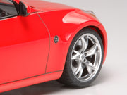 Tamiya 24315 1/24 Nissan 370Z model kit — assembled and painted front wheel and fender detail