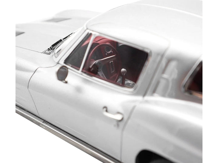 1963 Chevrolet Corvette Sting Ray Sebring Silver Metallic with Red Interior 1/18 Diecast Model Car by Norev image 2