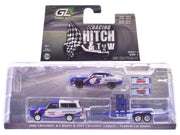 Packaged blue-and-white Kyle Larson K5 Blazer, No. 5 Camaro and tandem car trailer, GreenLight 1:64.