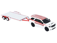 Angled view of the Ramchargers Durango and empty flatbed trailer with red trim, GreenLight 1:64 31190B.
