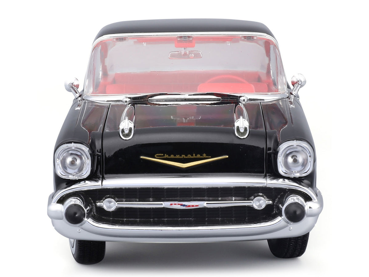 Black 1957 Chevrolet Bel Air coupe with red interior, unboxed front view, Maisto 1:18.