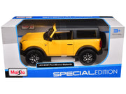 2021 Ford Bronco Badlands Yellow with Black Top "Special Edition" 1/24 Diecast Model Car by Maisto image 3