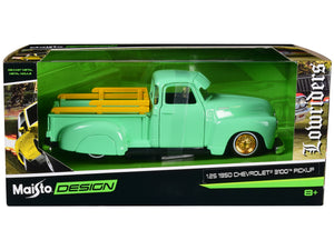 Light-green 1950 Chevrolet 3100 lowrider with gold wheels in Maisto Design packaging marked 1:25 scale.
