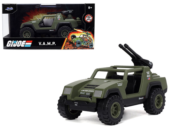 Olive green G.I. Joe V.A.M.P. 1:32 vehicle with open cabin and rear-mounted accessories, beside Jada 32660 packaging