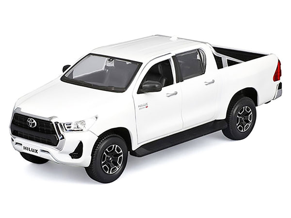 White Toyota Hilux pickup, unboxed front three-quarter view, Maisto 1:27.