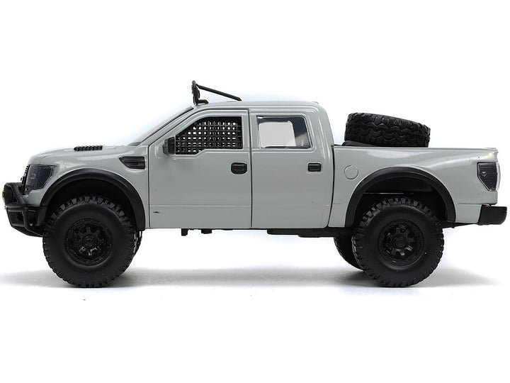 2011 Ford F-150 SVT Raptor Pickup Truck Light Gray with Extra Wheels "Just Trucks" Series 1/24 Diecast Model Car by Jada image 2