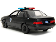 Ford Taurus OCP Matt Black "Detroit Police" and Robocop Diecast Figure 35th Anniversary "Robocop" (1987) Movie "Hollywood Rides" Series 1/24 Diecast Model Car by Jada image 2