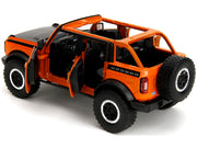 2021 Ford Bronco Open-Top Orange with Black Stripes and Hood with Extra Wheels "Just Trucks" Series 1/24 Diecast Model Car by Jada image 3